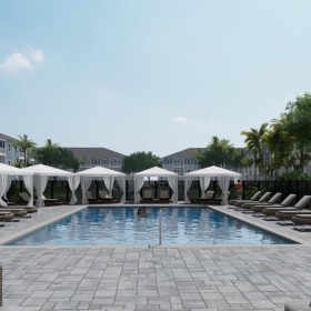a pool surrounded by chairs and cabanas